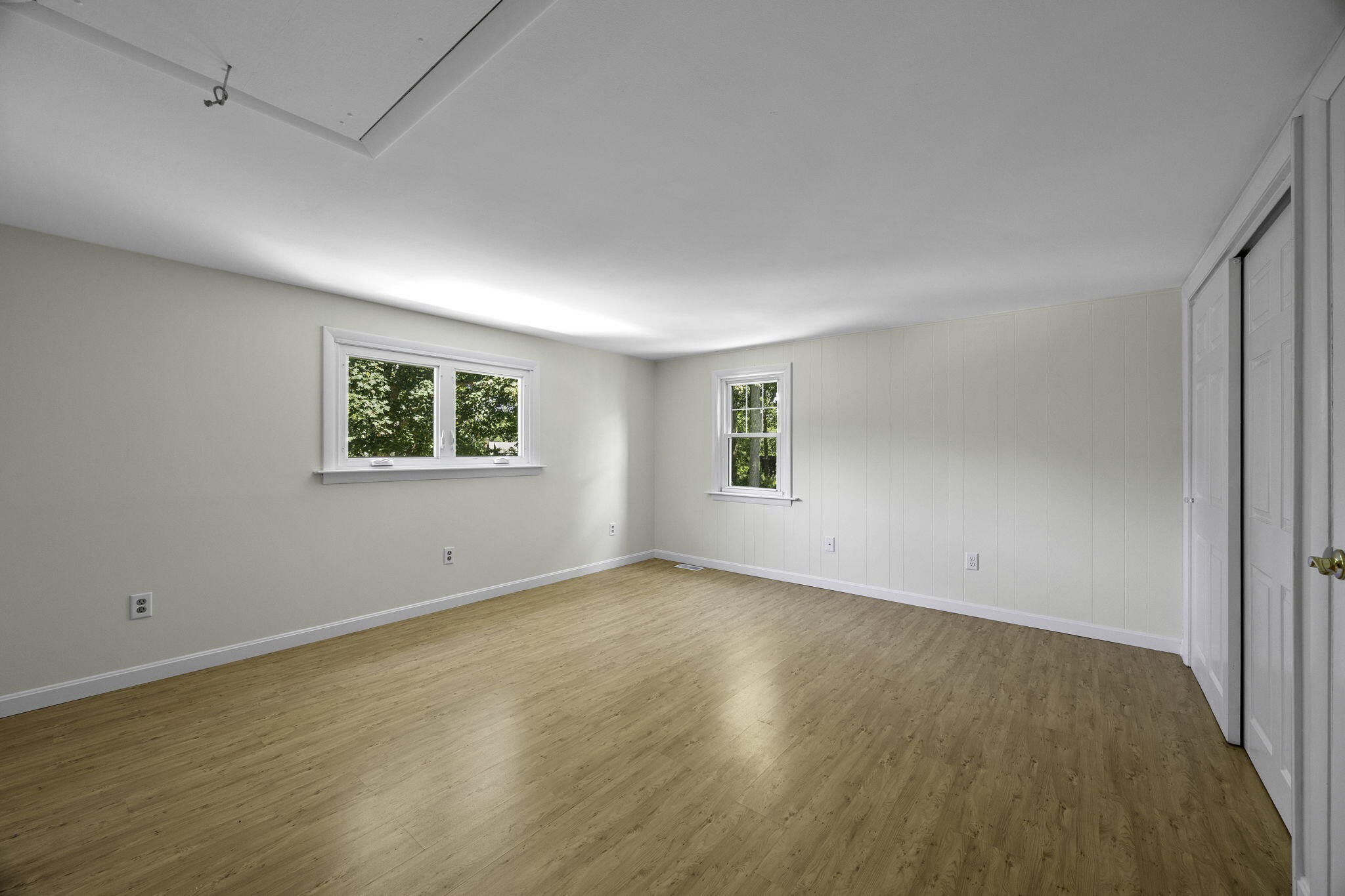 20 Namskaket Road Orleans, MA 02653 - Photo 24 of 63 a view of an empty room with wooden floor and a window
