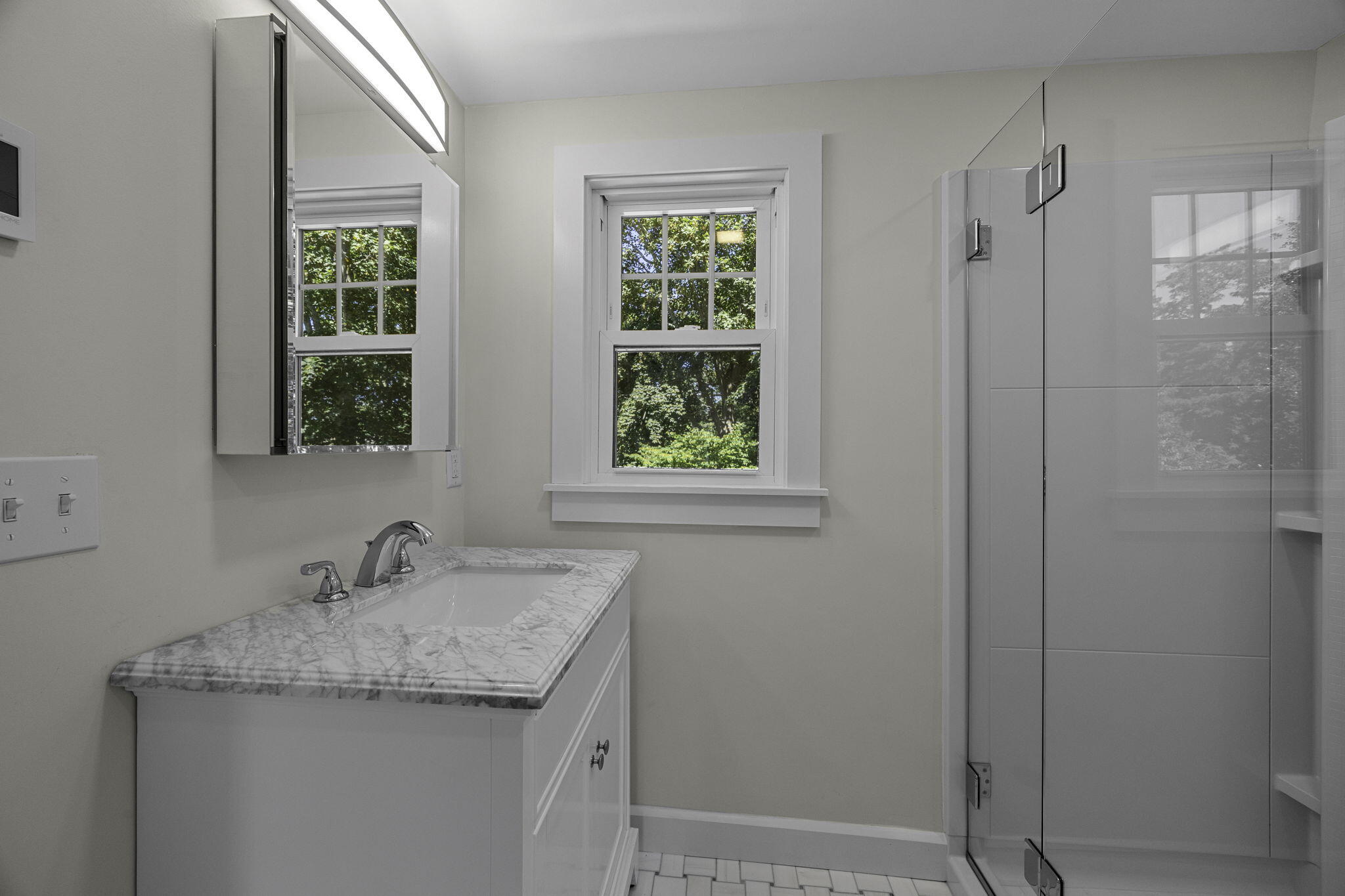 20 Namskaket Road Orleans, MA 02653 - Photo 31 of 63 a bathroom with a granite countertop sink a shower and a window