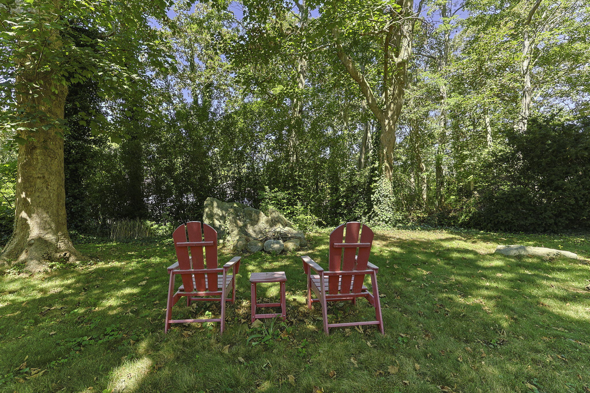 20 Namskaket Road Orleans, MA 02653 - Photo 46 of 63 a backyard of a house with table and chairs