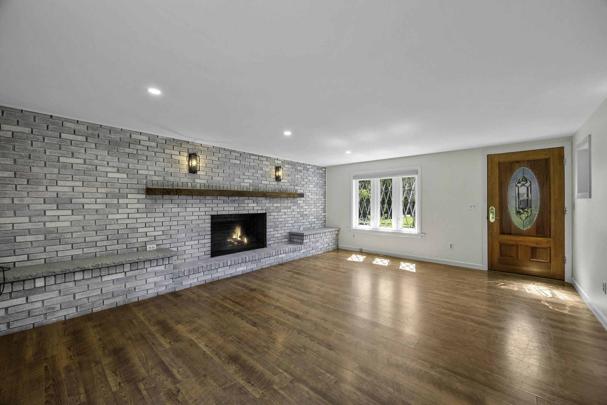 20 Namskaket Road Orleans, MA 02653 - Photo 10 of 63 a view of an empty room with a fireplace and a window