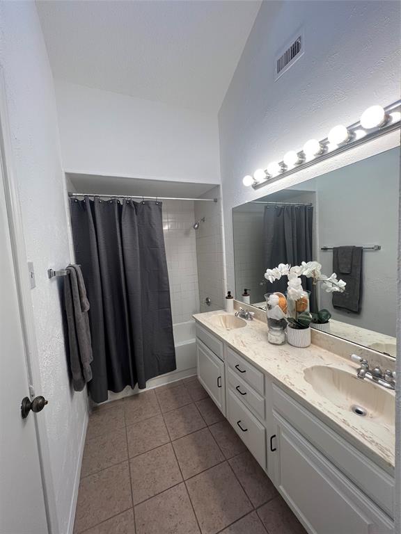 1758 Castille Drive Carrollton, TX 75007 - Photo 12 of 19 a bathroom with a double vanity sink and a mirror