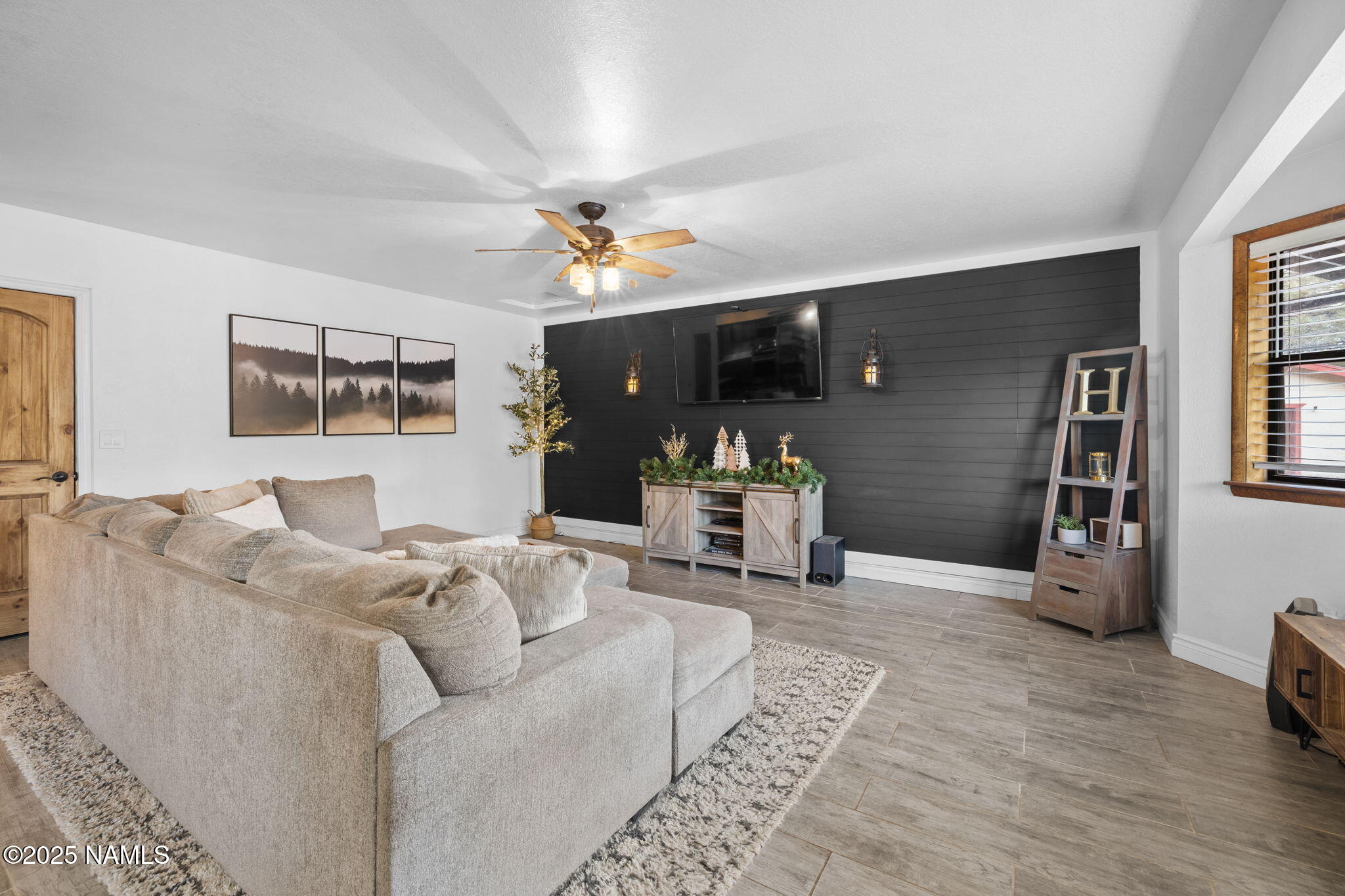 3628 East Pine Cone Drive Williams, AZ 86046 - Photo 15 of 23 a living room with furniture and wooden floor