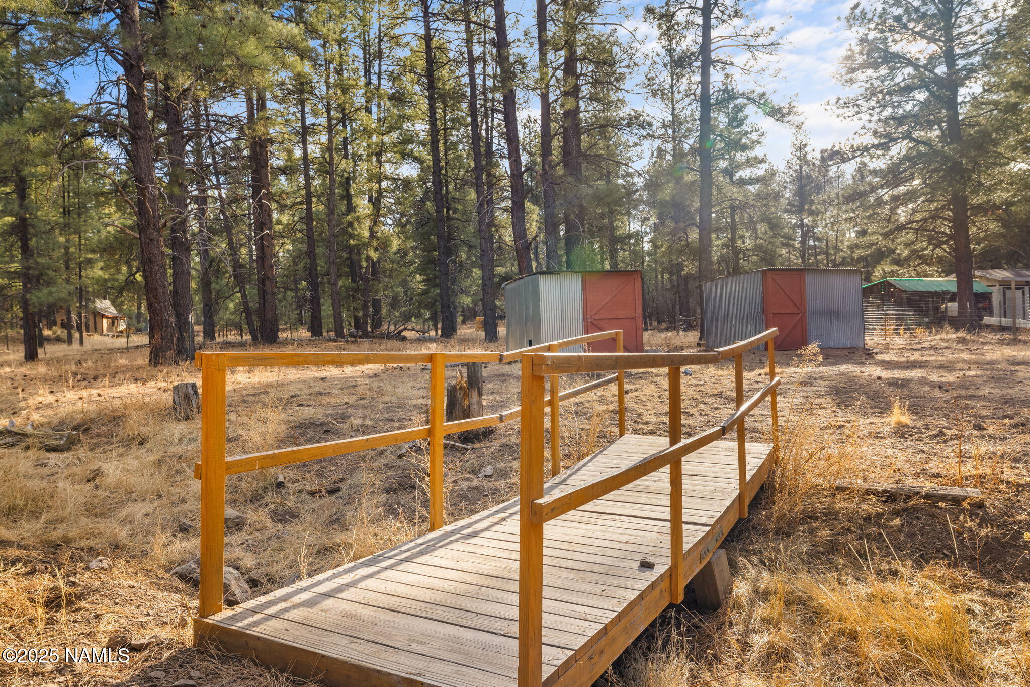 3628 East Pine Cone Drive Williams, AZ 86046 - Photo 17 of 23 a view of a balcony with chairs