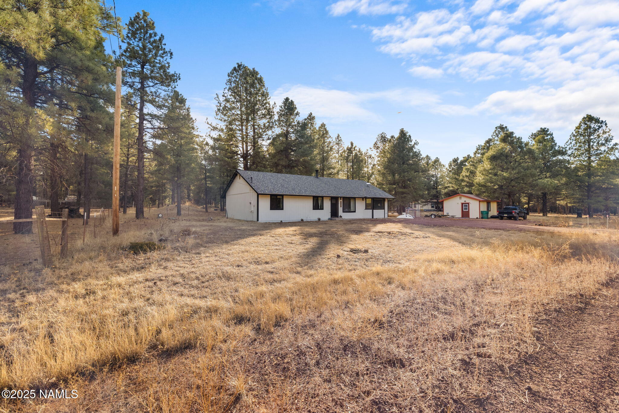 3628 East Pine Cone Drive Williams, AZ 86046 - Photo 23 of 23 a house view with swimming pool in front of it