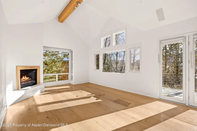 a kitchen with granite countertop a stove a sink and a refrigerator