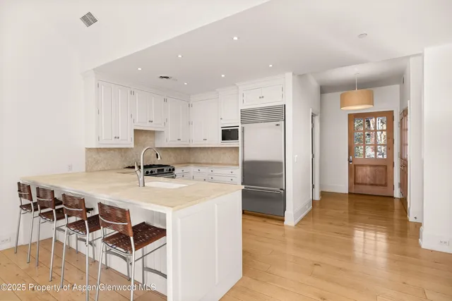 a bathroom with a sink a mirror and a bathtub