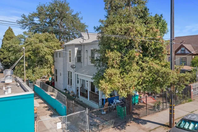 aerial view of a house with a tree