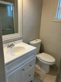 a bathroom with a toilet and a sink