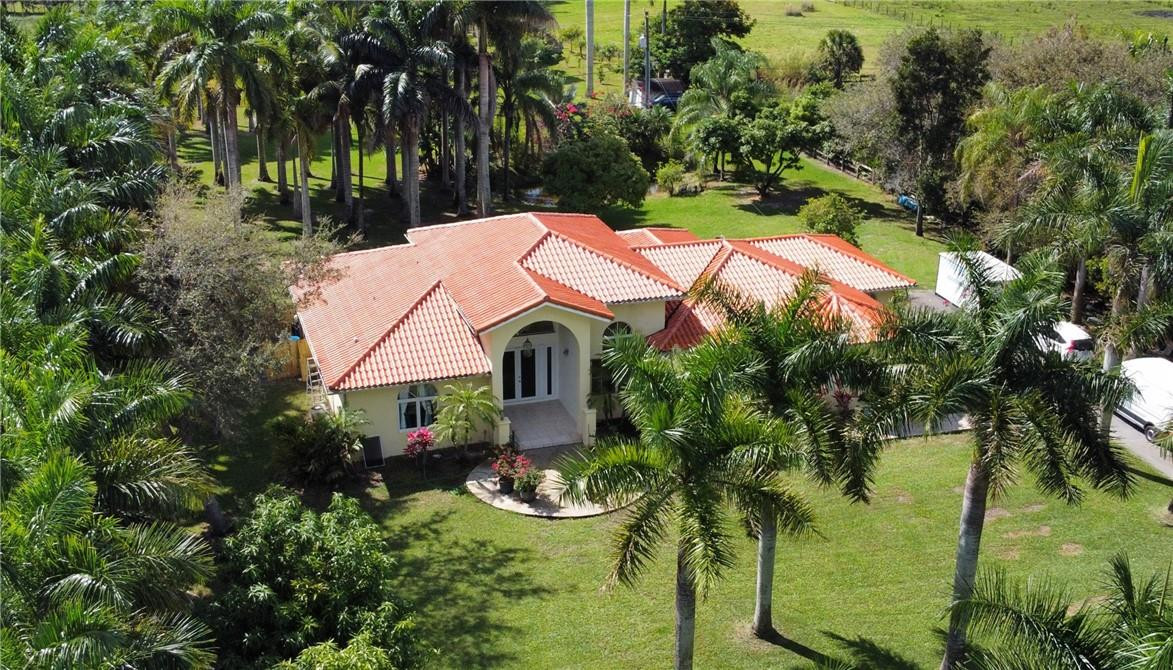 17400 Southwest 66th Street Southwest Ranches, FL 33331 - Photo 1 of 38 an aerial view of a house with swimming pool garden and patio