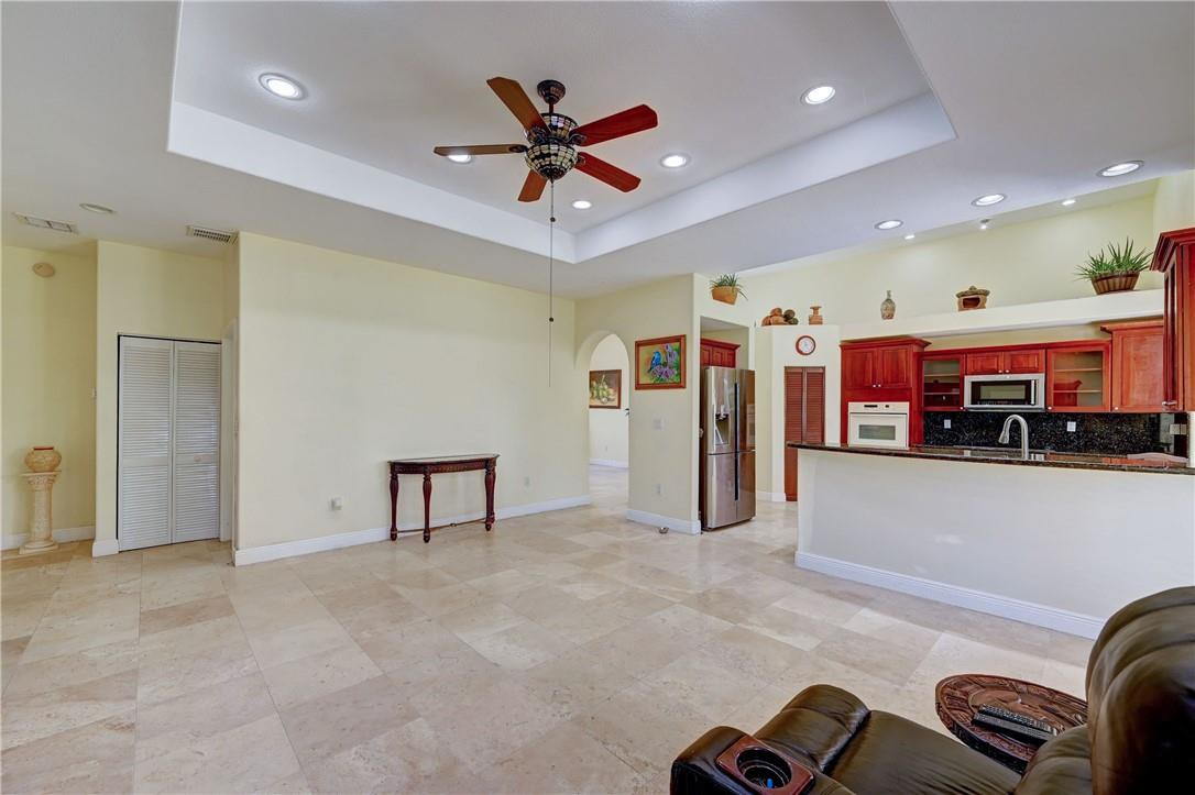 17400 Southwest 66th Street Southwest Ranches, FL 33331 - Photo 19 of 38 a view of a livingroom with furniture and a ceiling fan
