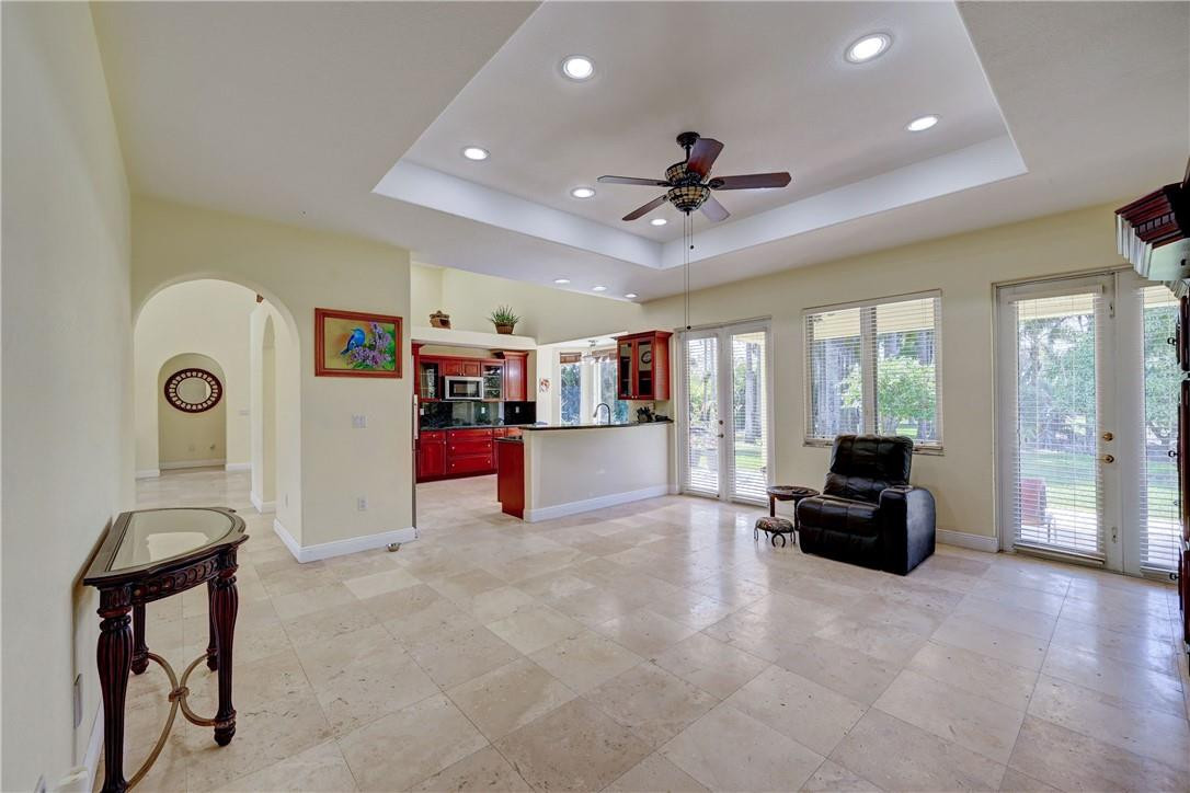 17400 Southwest 66th Street Southwest Ranches, FL 33331 - Photo 20 of 38 a living room with furniture and a chandelier