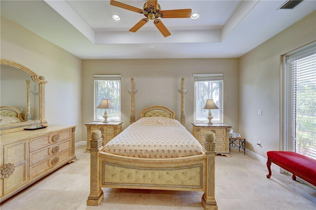 17400 Southwest 66th Street Southwest Ranches, FL 33331 - Photo 25 of 38 a bedroom with a bed and window