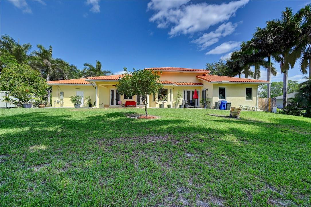 17400 Southwest 66th Street Southwest Ranches, FL 33331 - Photo 33 of 38 a front view of a house with garden