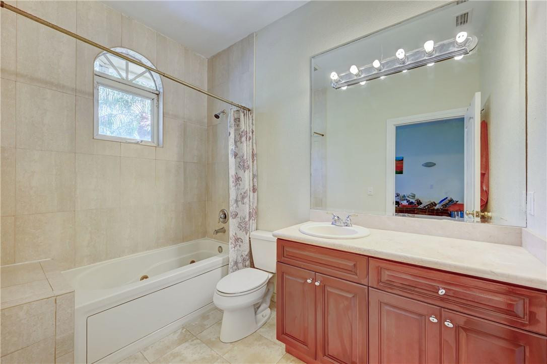 17400 Southwest 66th Street Southwest Ranches, FL 33331 - Photo 37 of 38 a bathroom with a sink a toilet and shower