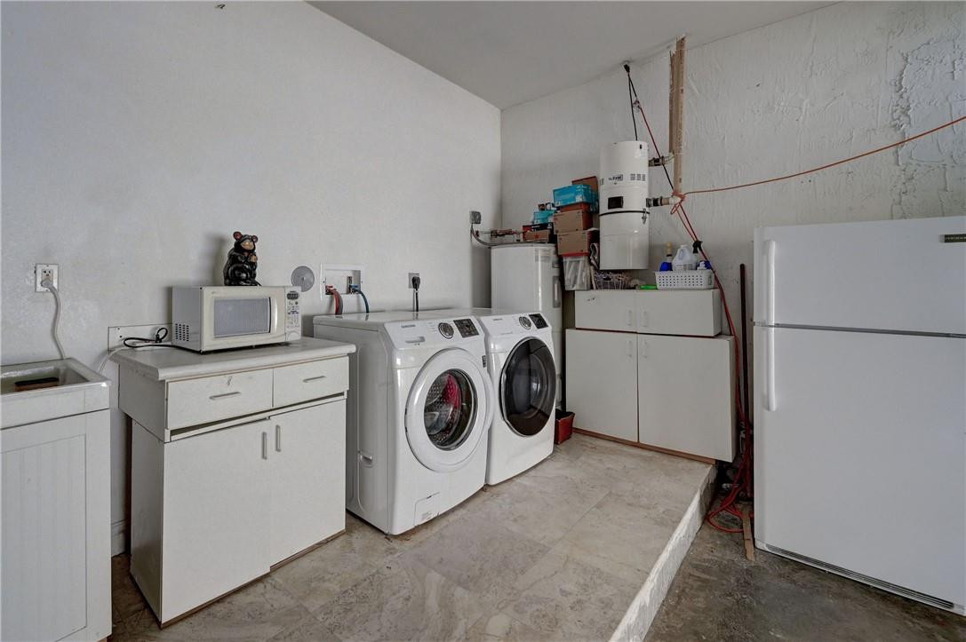 17400 Southwest 66th Street Southwest Ranches, FL 33331 - Photo 38 of 38 a utility room with dryer and washer