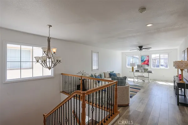 a view of entryway livingroom and hall with wooden floor