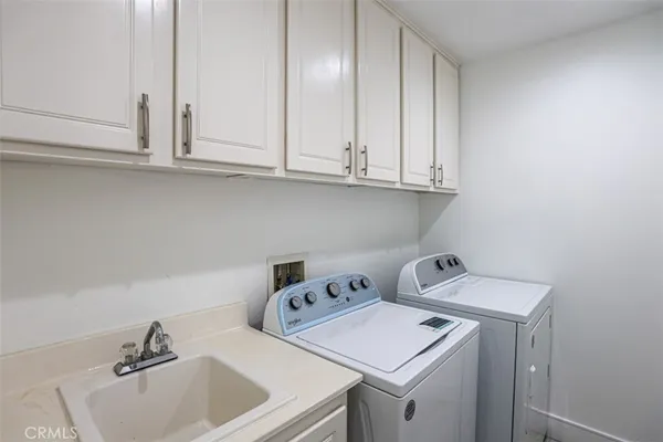 a bathroom with a sink and cabinets
