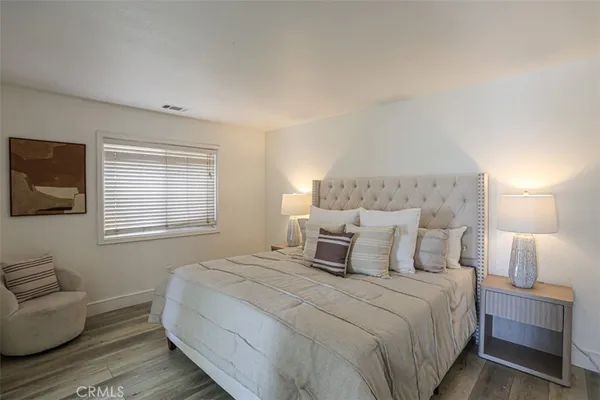 a bedroom with a bed and a couch