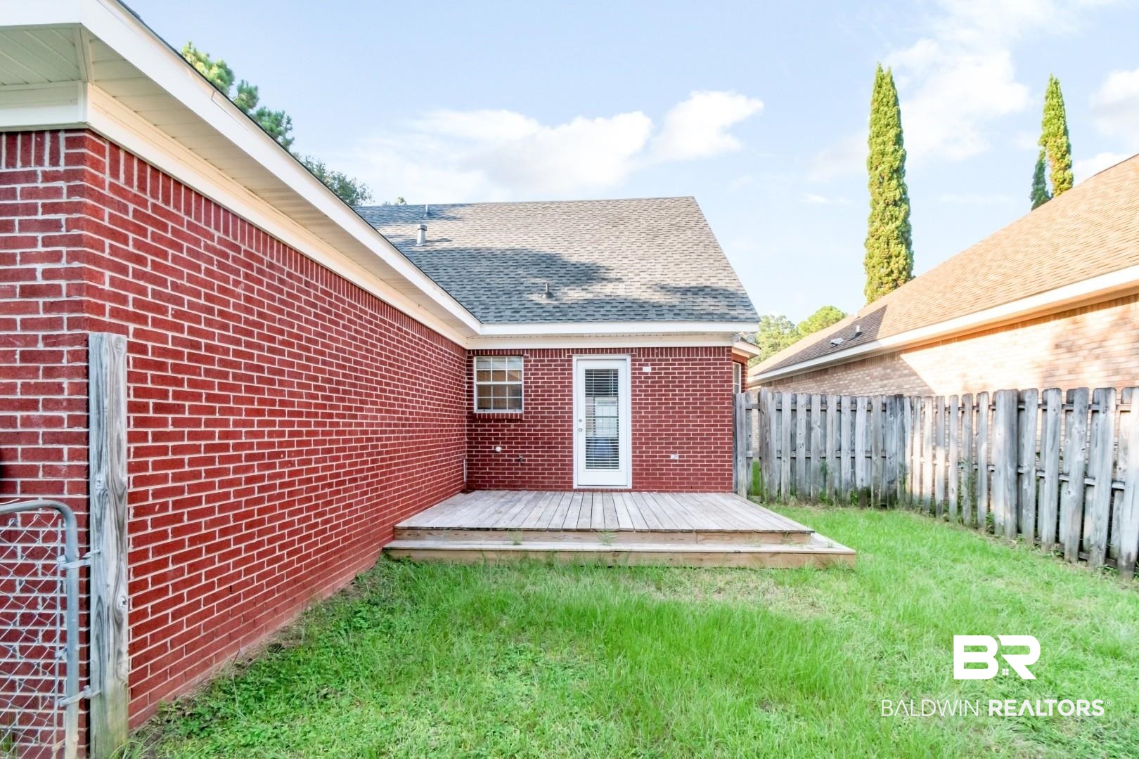 6482 Cedar Bend Court Mobile, AL 36608 - Photo 22 of 26 Back of house featuring brick siding, a wooden deck, and roof with shingles