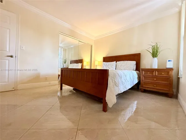 a bedroom with a bed and a cabinets