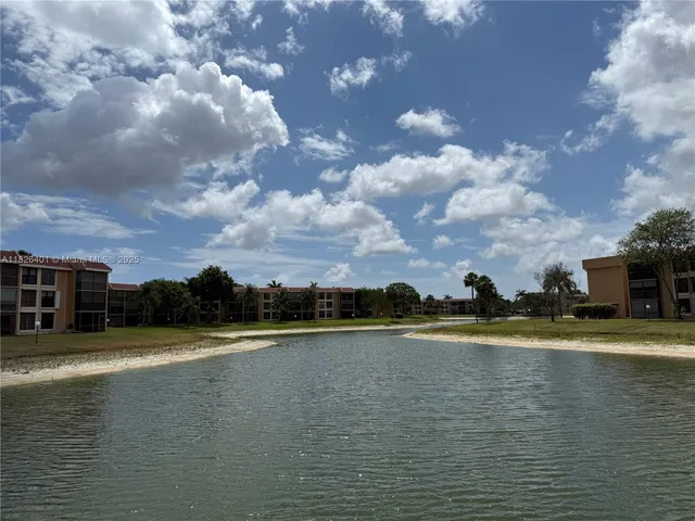 a view of a swimming pool and an outdoor seating
