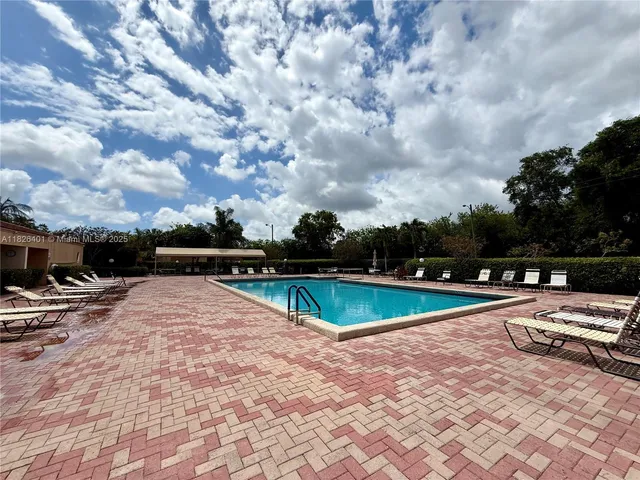 a view of swimming pool with lounge chair
