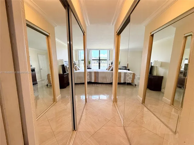 a lobby with furniture and a rug