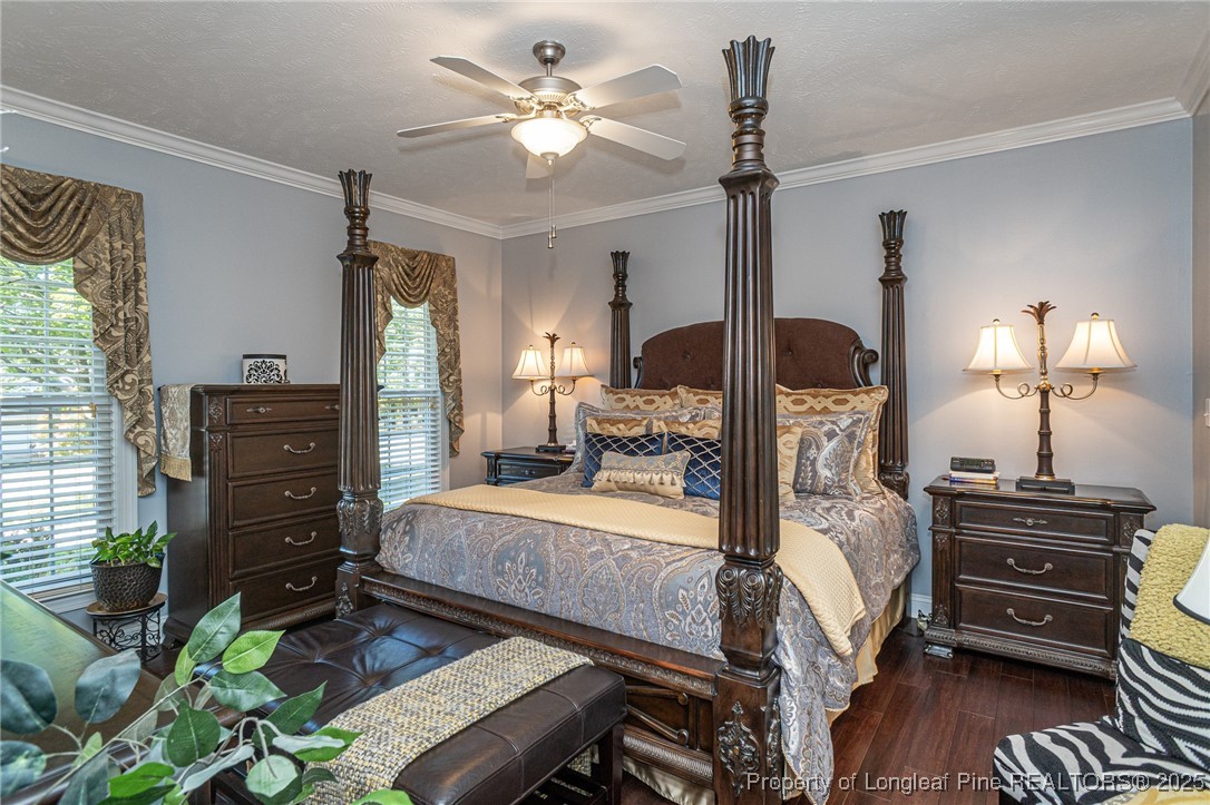 595 Whispering Pines Drive Spring Lake, NC 28390 - Photo 21 of 48 a bedroom with a bed and a dresser