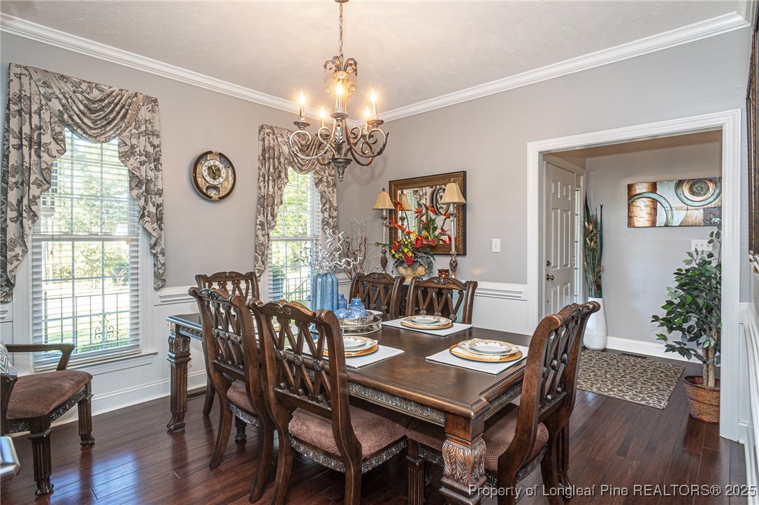595 Whispering Pines Drive Spring Lake, NC 28390 - Photo 7 of 48 a view of a dining room with furniture window and wooden floor