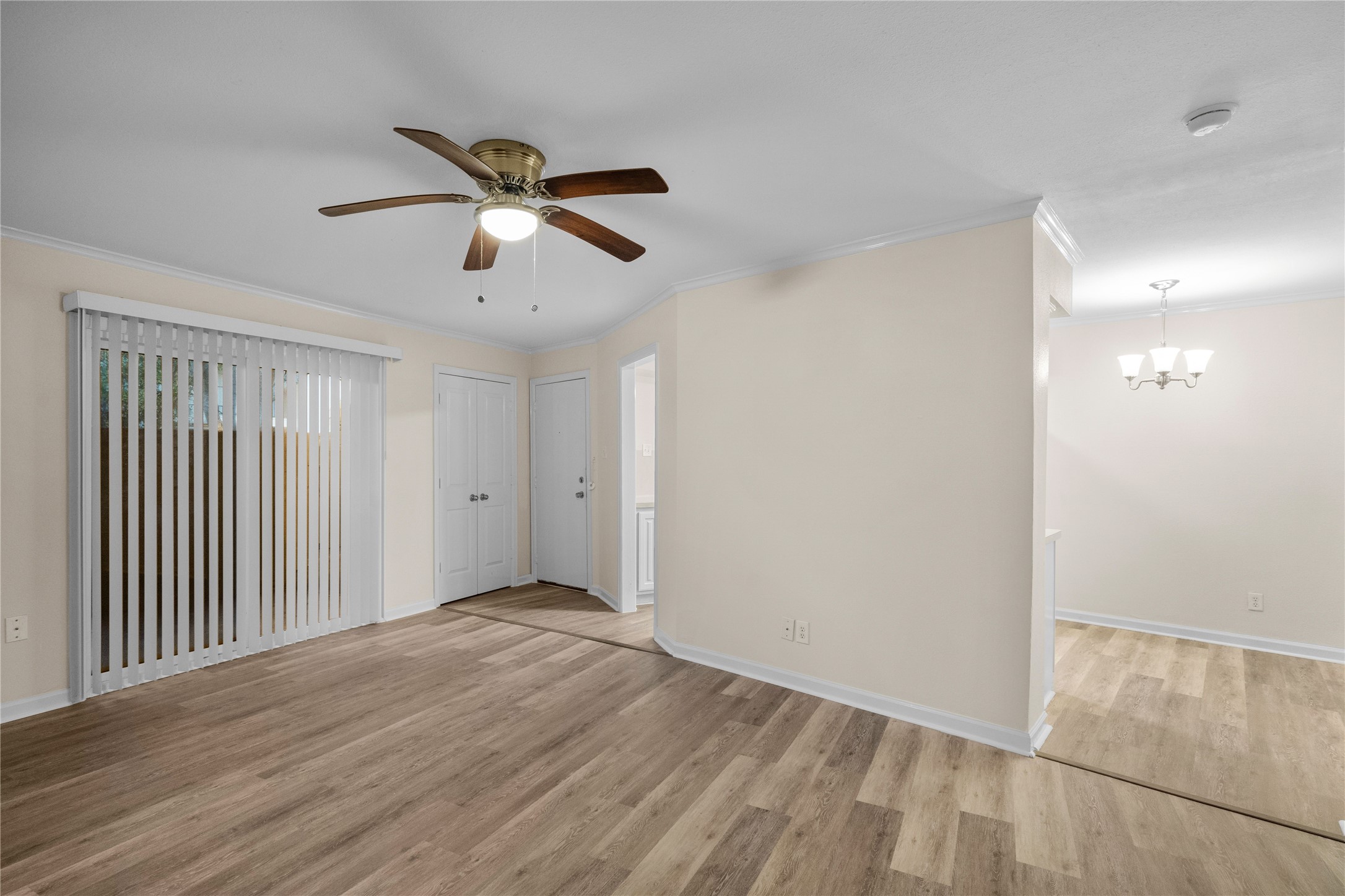 102 Strand Street, Unit 3 Galveston, TX 77550 - Photo 1 of 19 a view of empty room with wooden floor and fan