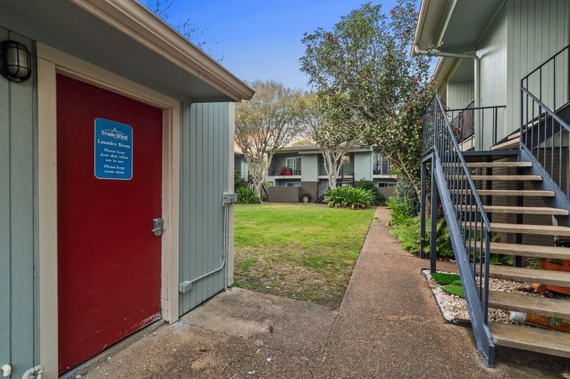 102 Strand Street, Unit 3 Galveston, TX 77550 - Photo 16 of 19 a view of a house with a yard