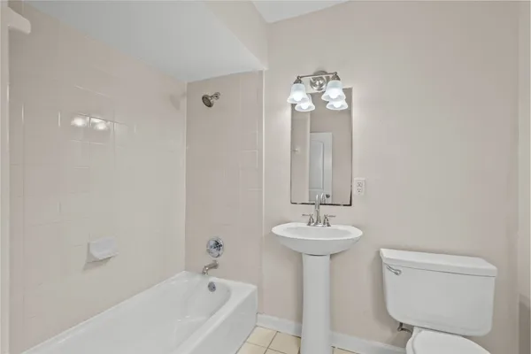 a bathroom with a sink bathtub and a toilet