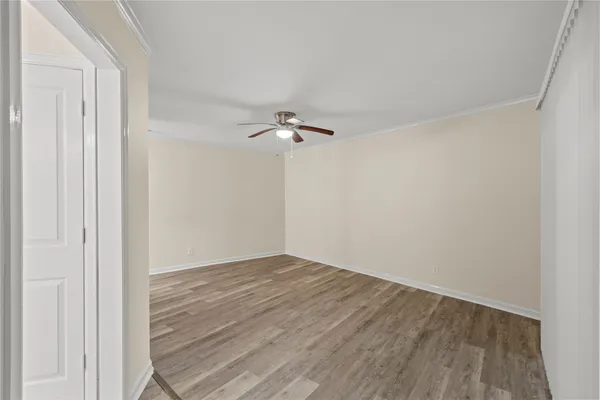 a view of a room with wooden floor