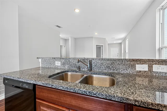 a kitchen with a sink and cabinets