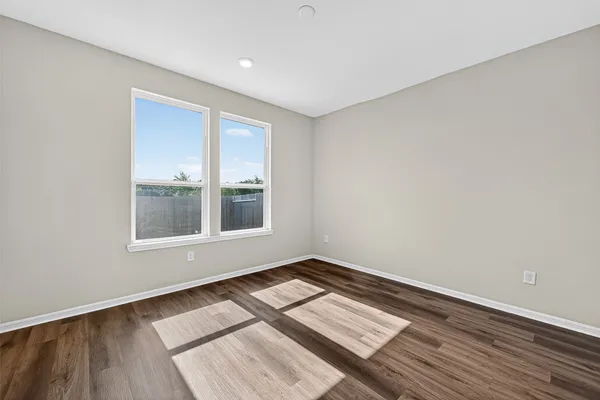 a view of wooden floor in an empty room