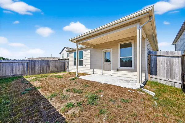 a house view with a backyard space