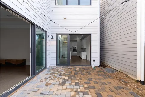 a view of a hallway with wooden shelves