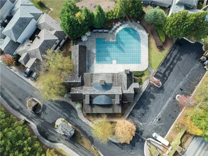 an aerial view of a house with outdoor space