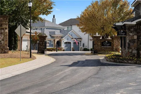 a view of multiple houses with a street