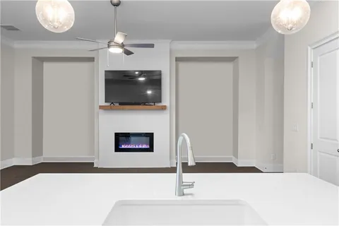 a living room with fireplace and a flat screen tv