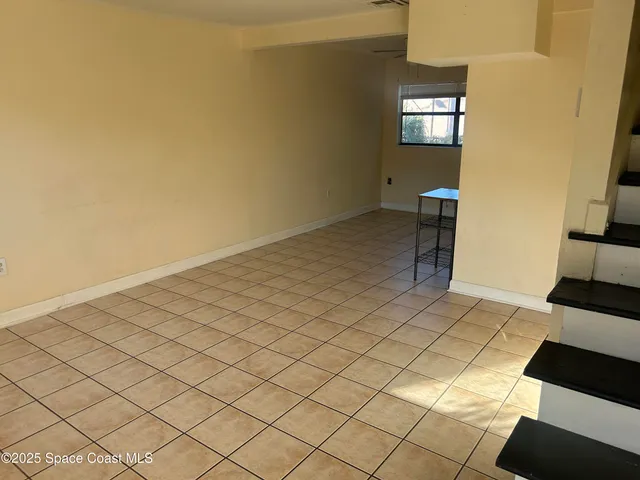 a view of a livingroom and entryway