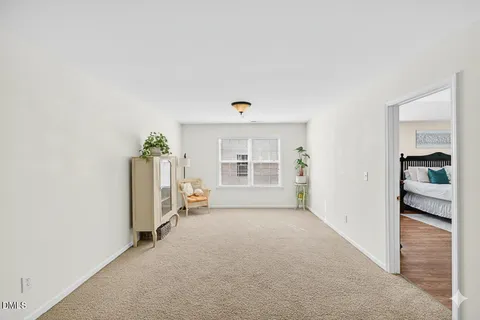 an empty room with furniture and a window