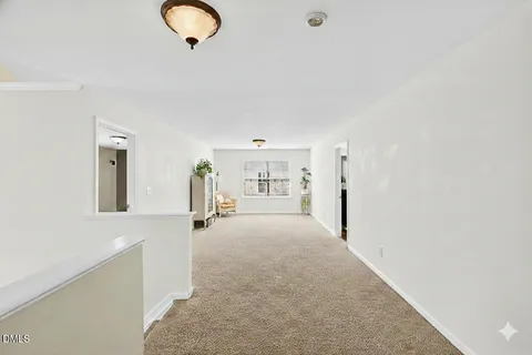 a spacious bedroom with a bed and a window