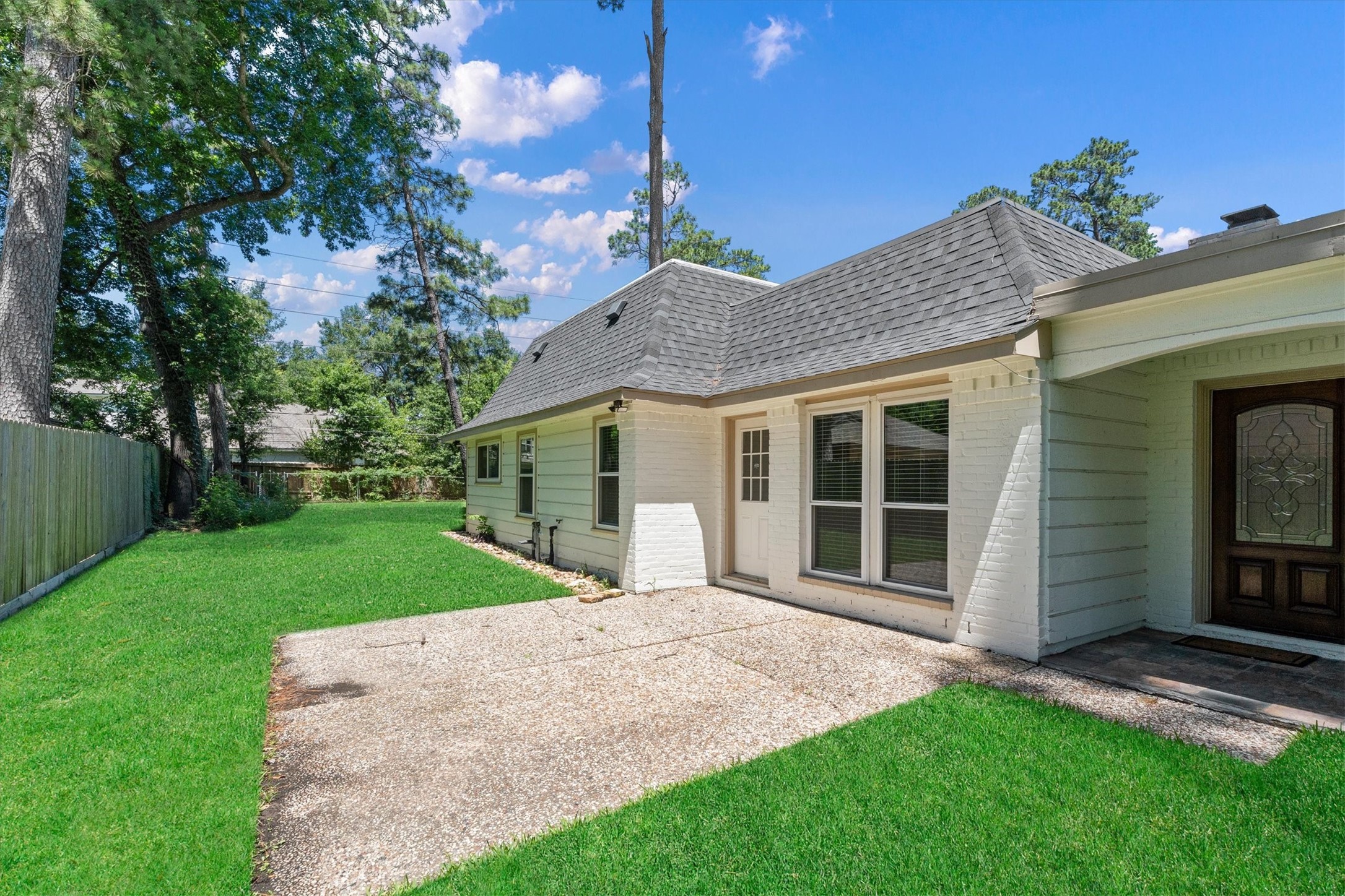 6530 Bayonne Drive Spring, TX 77389 - Photo 6 of 37 a front view of a house with a garden and yard