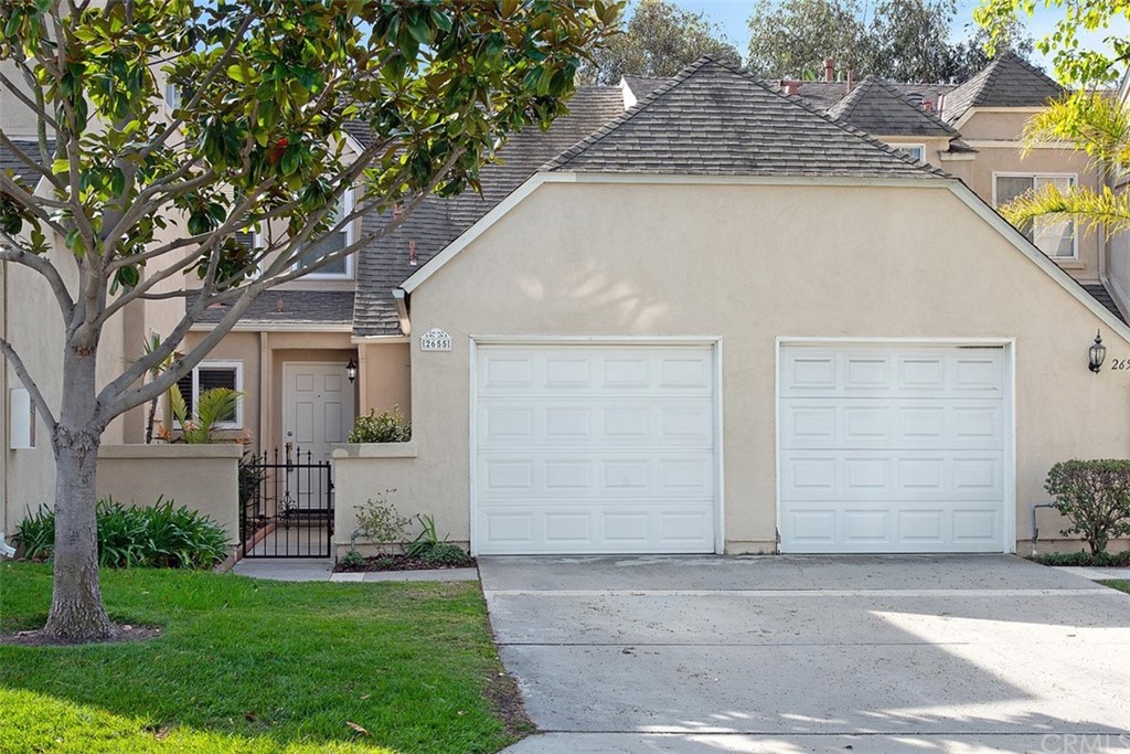 2655 Regent Road Carlsbad, CA 92010 - Photo 1 of 1 a house that has a tree in front of the house