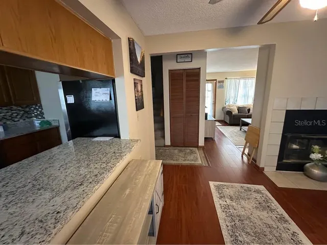 a living room with furniture and a rug