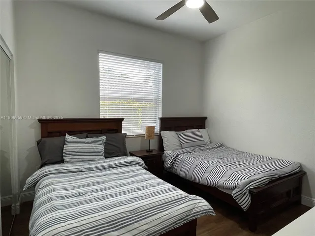 a bathroom with a tub sink toilet and shower