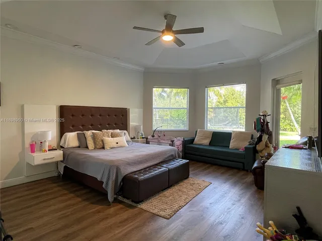 a bathroom with a large tub sink shower and view living room