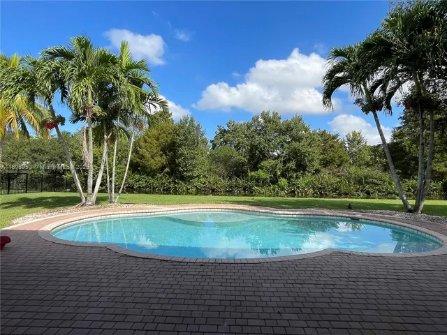 a view of a house with a yard porch and sitting area