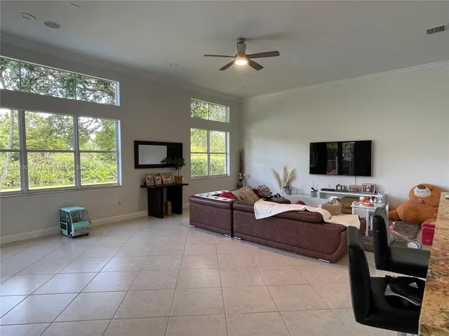 a bathroom with a granite countertop toilet sink and shower